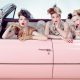 Women in a pink car